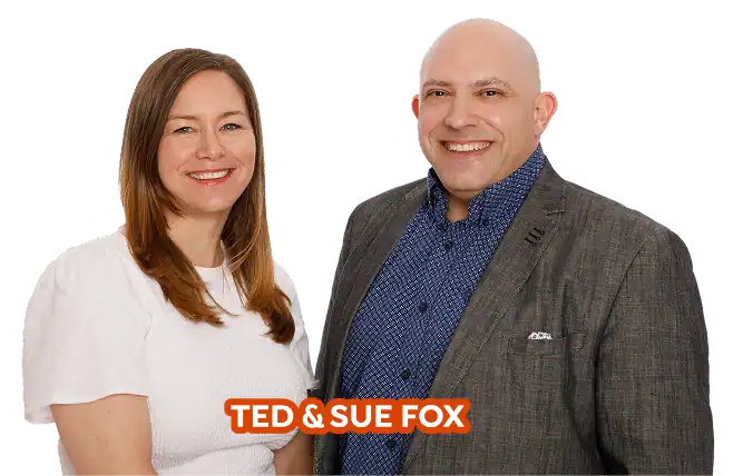 A woman in a white shirt and a man in a gray blazer stand side by side, smiling, with the text "TED & SUE FOX" displayed at the bottom.